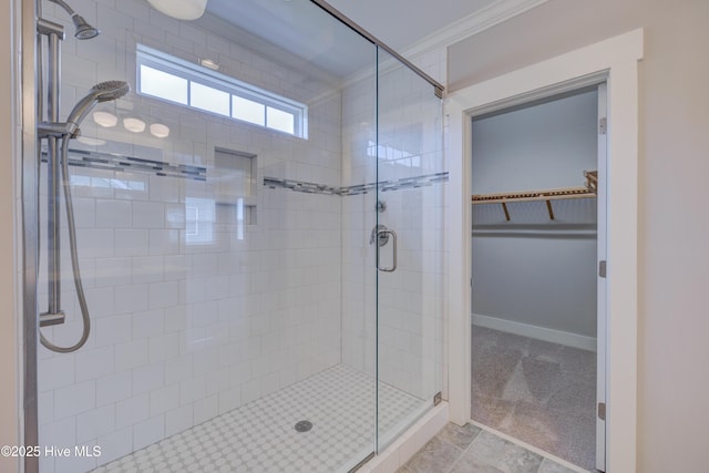 1012 Anchors Bend Way, Wilmington, NC 28411 - bathroom featuring crown molding, baseboards, a shower stall, and a spacious closet