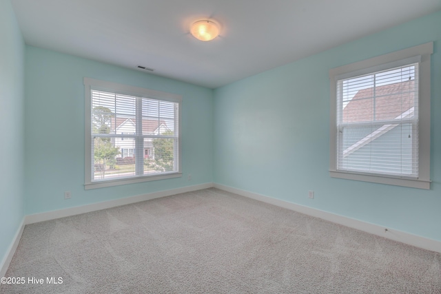 1012 Anchors Bend Way, Wilmington, NC 28411 - carpeted spare room with baseboards, visible vents, and a wealth of natural light