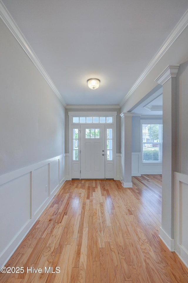 1012 Anchors Bend Way, Wilmington, NC 28411 - foyer with plenty of natural light, light wood-style flooring, a decorative wall, and ornate columns