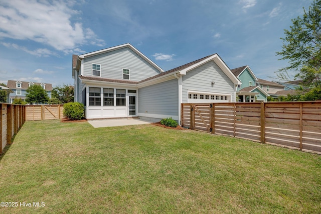 1012 Anchors Bend Way, Wilmington, NC 28411 - back of property with a lawn, a fenced backyard, a sunroom, and a garage