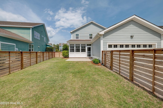 1012 Anchors Bend Way, Wilmington, NC 28411 - rear view of property featuring a lawn, a fenced backyard, and a sunroom