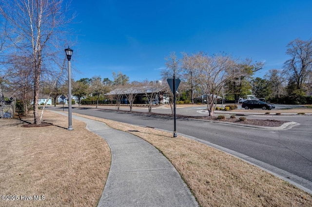 1012 Anchors Bend Way, Wilmington, NC 28411 - view of road featuring curbs, sidewalks, street lights, and traffic signs