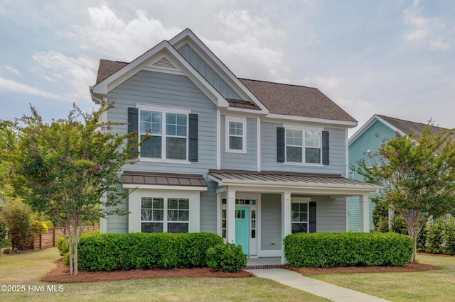 1012 Anchors Bend Way, Wilmington, NC 28411 - view of front of property with metal roof, a standing seam roof, fence, and roof with shingles