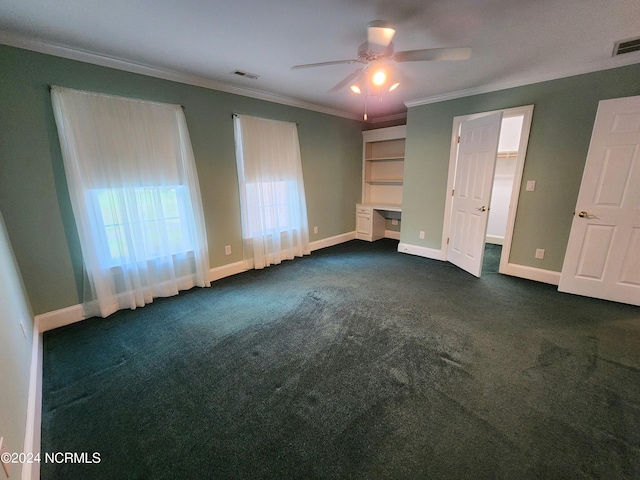 unfurnished bedroom with crown molding, baseboards, dark carpet, and visible vents
