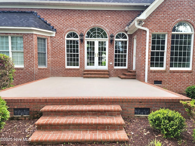 exterior space with a patio area, french doors, and entry steps