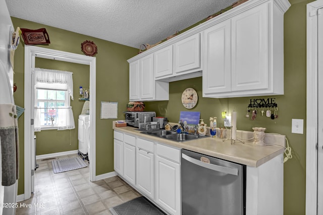 kitchen with dishwasher, a sink, white cabinets, light countertops, and a textured ceiling