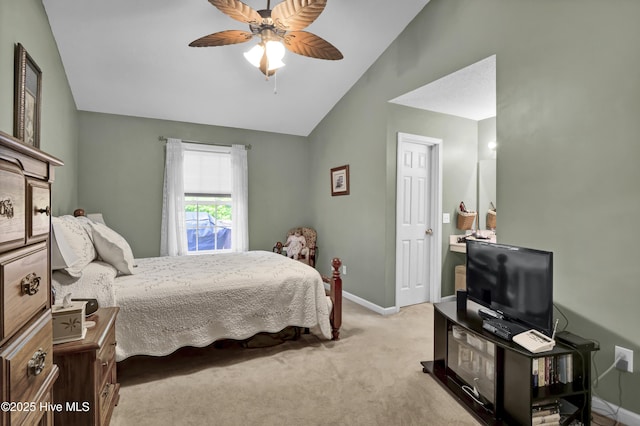 carpeted bedroom featuring lofted ceiling, baseboards, and a ceiling fan