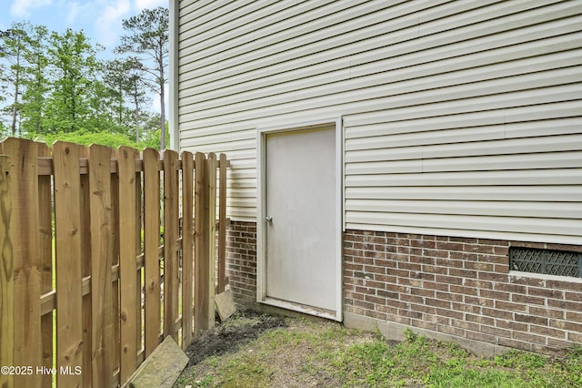 property entrance with fence