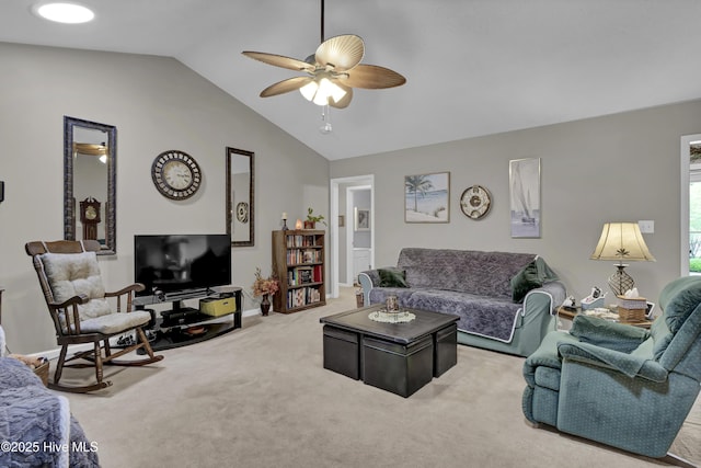 living area with ceiling fan, vaulted ceiling, carpet, and baseboards