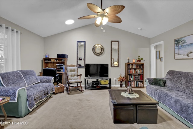 living area with carpet flooring, vaulted ceiling, ceiling fan, and baseboards