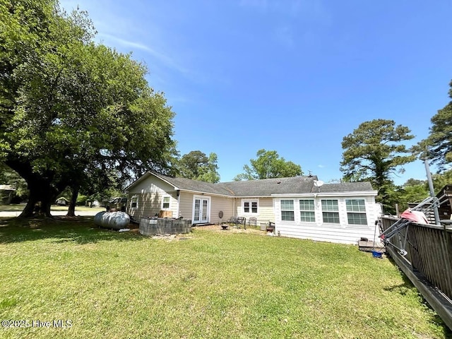 1281 Old Chinquapin Rd, Beulaville, NC 28518 - rear view of house featuring a lawn and french doors