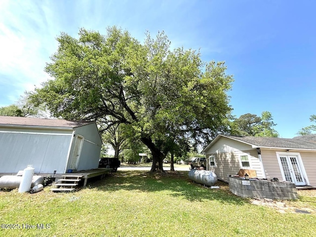 1281 Old Chinquapin Rd, Beulaville, NC 28518 - view of grassy yard with french doors and a wooden deck