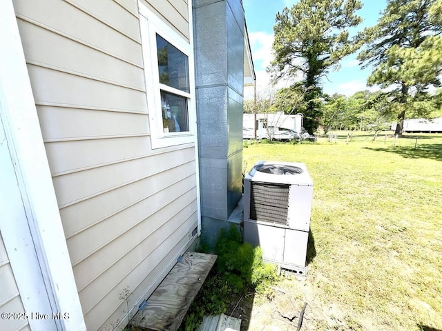 1281 Old Chinquapin Rd, Beulaville, NC 28518 - view of side of home featuring cooling unit and a lawn