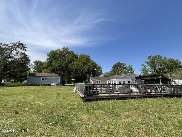 1281 Old Chinquapin Rd, Beulaville, NC 28518 - view of green lawn with a wooden deck