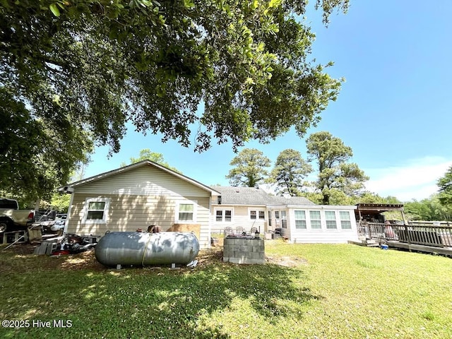 1281 Old Chinquapin Rd, Beulaville, NC 28518 - rear view of property featuring a wooden deck, a yard, and heating fuel