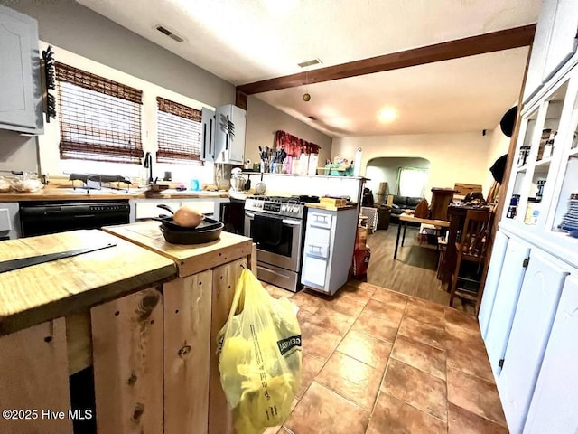 1281 Old Chinquapin Rd, Beulaville, NC 28518 - kitchen featuring gas stove, dishwasher, butcher block counters, light tile patterned floors, and open floor plan