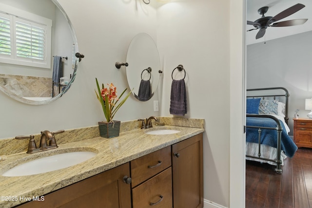 6439 Stopper Ln SW, Ocean Isle Beach, NC 28469 - ensuite bathroom featuring ceiling fan, a sink, double vanity, and ensuite bathroom