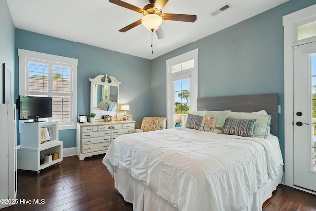 6439 Stopper Ln SW, Ocean Isle Beach, NC 28469 - bedroom featuring hardwood / wood-style flooring, baseboards, multiple windows, and visible vents