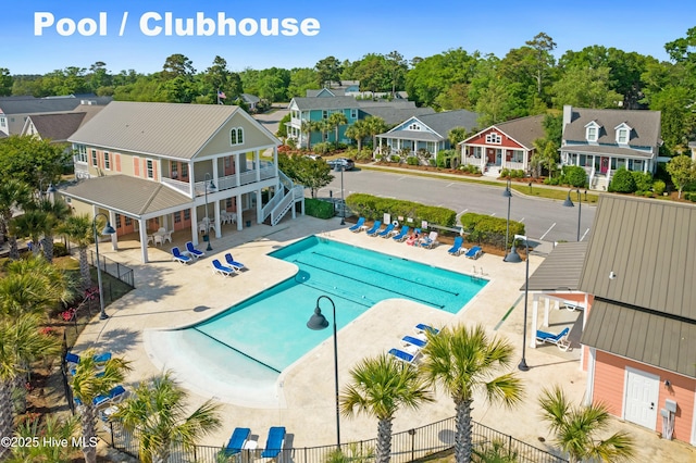 6439 Stopper Ln SW, Ocean Isle Beach, NC 28469 - pool with a residential view, a patio, and fence