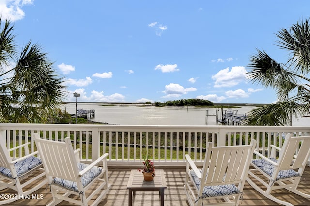 wooden deck with a water view