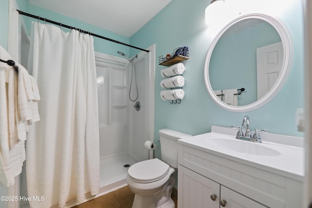 full bathroom featuring a shower with curtain, tile patterned floors, toilet, and vanity
