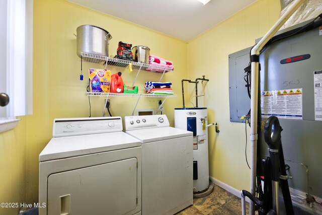 clothes washing area featuring laundry area, heating unit, washer and dryer, electric panel, and electric water heater