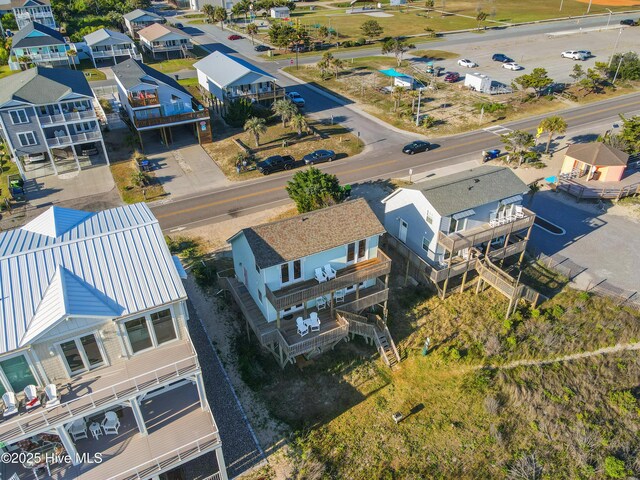 aerial view featuring a water view and a view of the beach