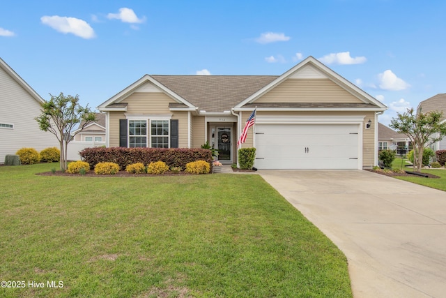 view of front of home with a shingled roof, a front lawn, driveway, and an attached garage