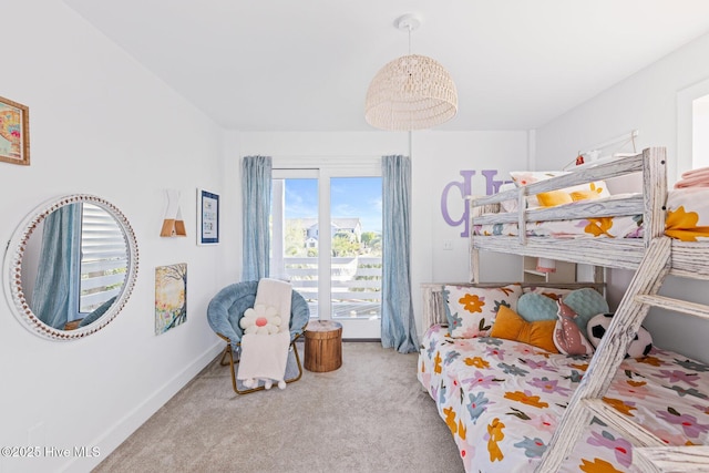 bedroom with baseboards and carpet flooring