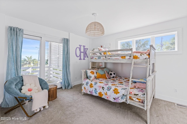 bedroom featuring baseboards, carpet flooring, and visible vents