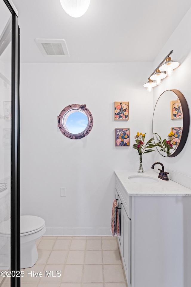full bath with visible vents, vanity, toilet, baseboards, and a shower stall