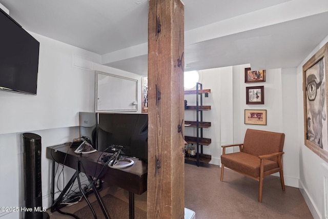 carpeted home office with baseboards
