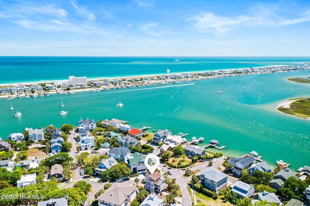 birds eye view of property with a water view and a residential view