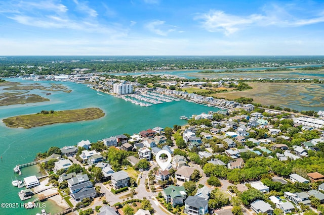 drone / aerial view featuring a water view and a residential view