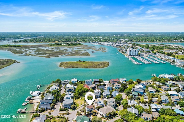 drone / aerial view featuring a water view and a residential view