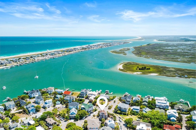 bird's eye view featuring a residential view, a beach view, and a water view