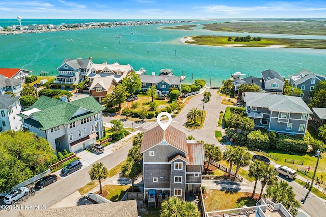 birds eye view of property featuring a residential view and a water view