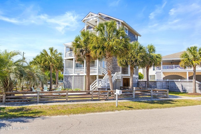 coastal inspired home with fence private yard