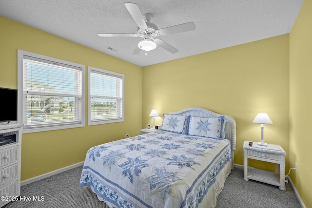 bedroom featuring baseboards, a ceiling fan, and carpet flooring