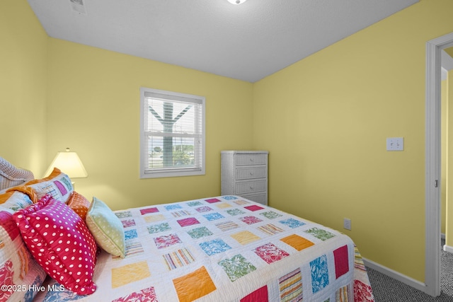carpeted bedroom with baseboards and visible vents