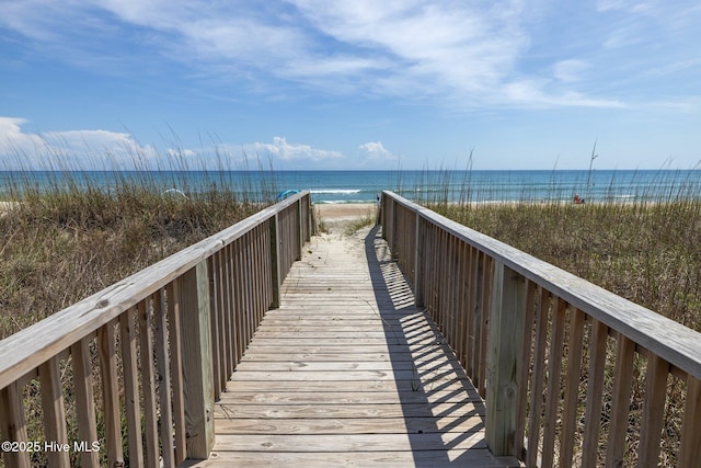 view of home's community featuring a view of the beach and a water view