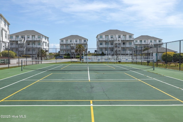 view of sport court with fence