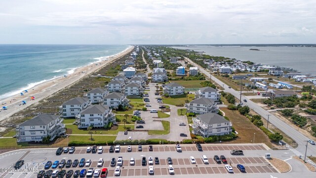 drone / aerial view featuring a view of the beach and a water view