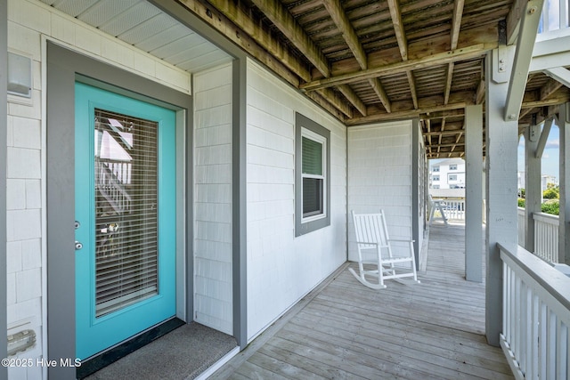 doorway to property featuring covered porch