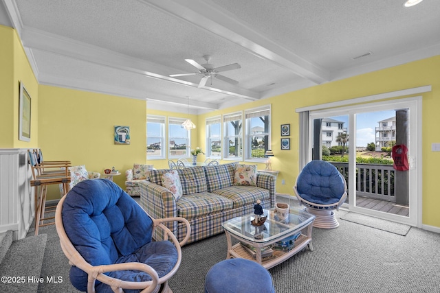 carpeted living area featuring beam ceiling, visible vents, a textured ceiling, and baseboards