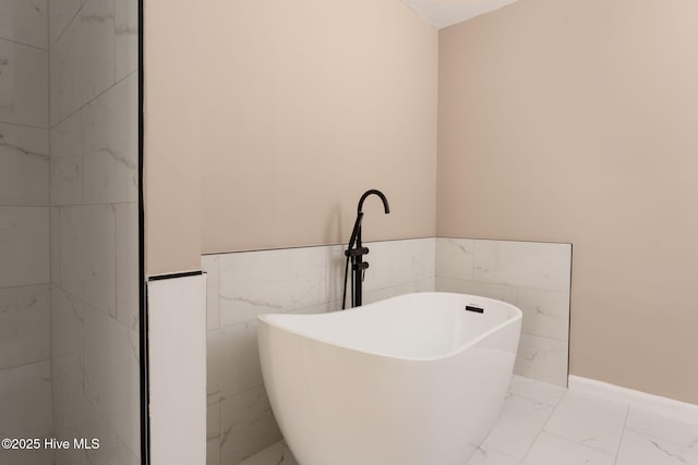 bathroom featuring double vanity, a sink, marble finish floor, and toilet