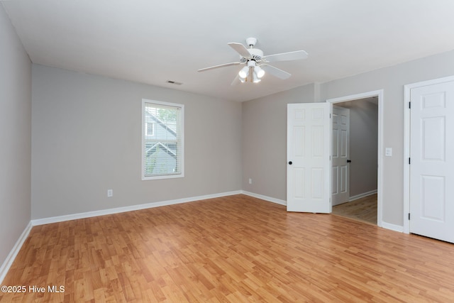 7300 Oyster Ln, Wilmington, NC 28411 - spare room featuring light wood-style flooring, baseboards, and a ceiling fan