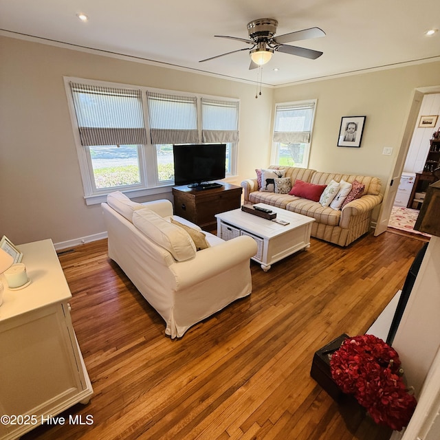 living room featuring hardwood / wood-style flooring, a ceiling fan, crown molding, and recessed lighting