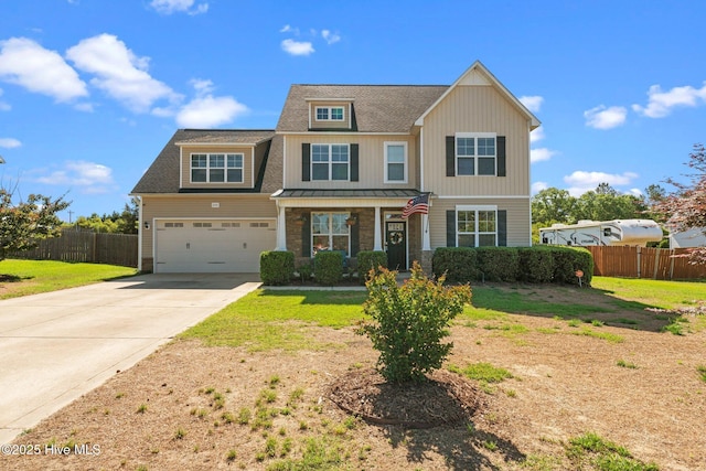 view of front of property with concrete driveway, a standing seam roof, a garage, roof with shingles, and metal roof