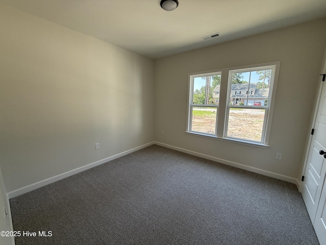 1104 Margaret Ln, Kinston, NC 28501 - carpeted empty room featuring baseboards